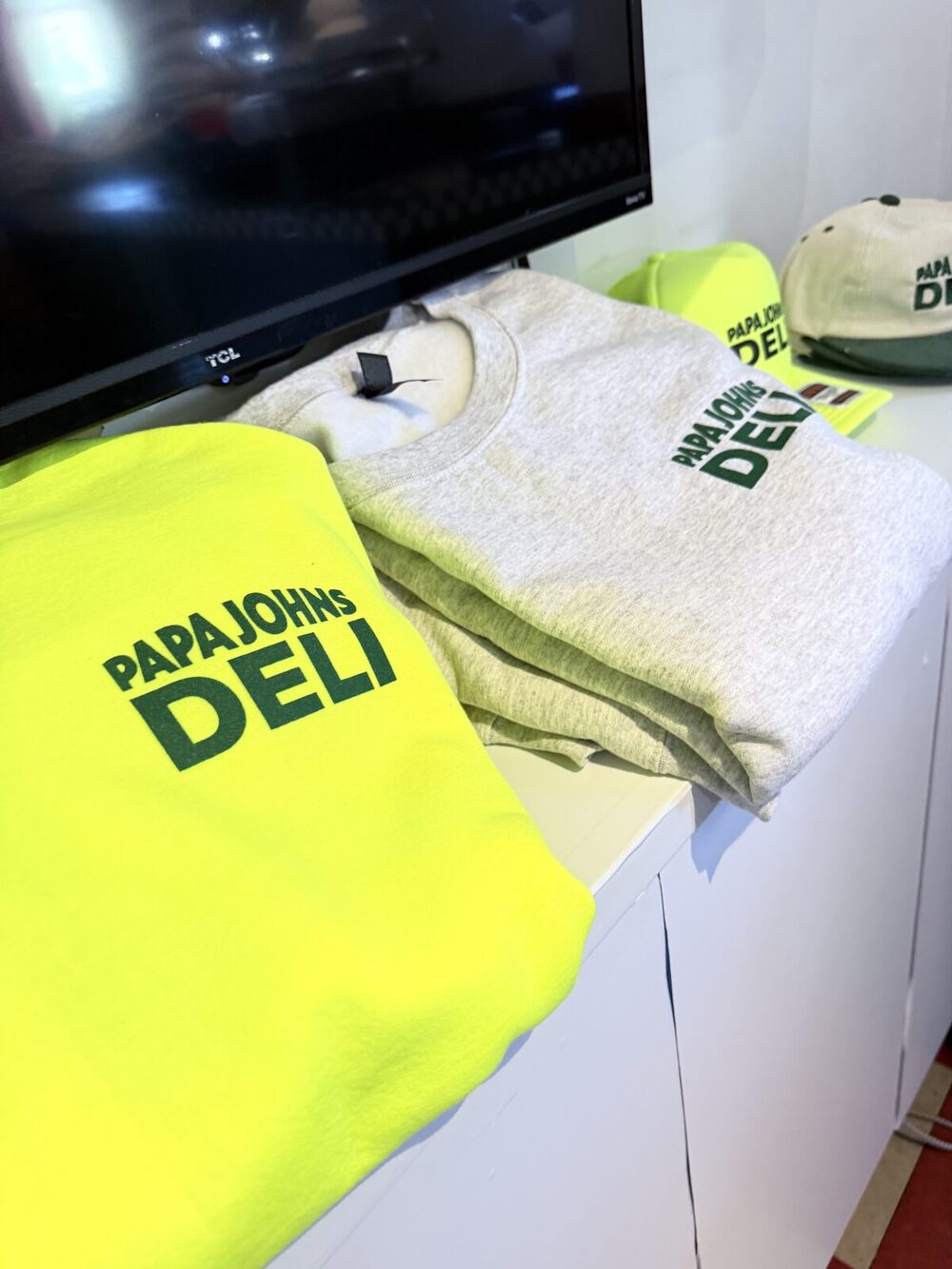 Freshly pressed custom merch laid out for pickup