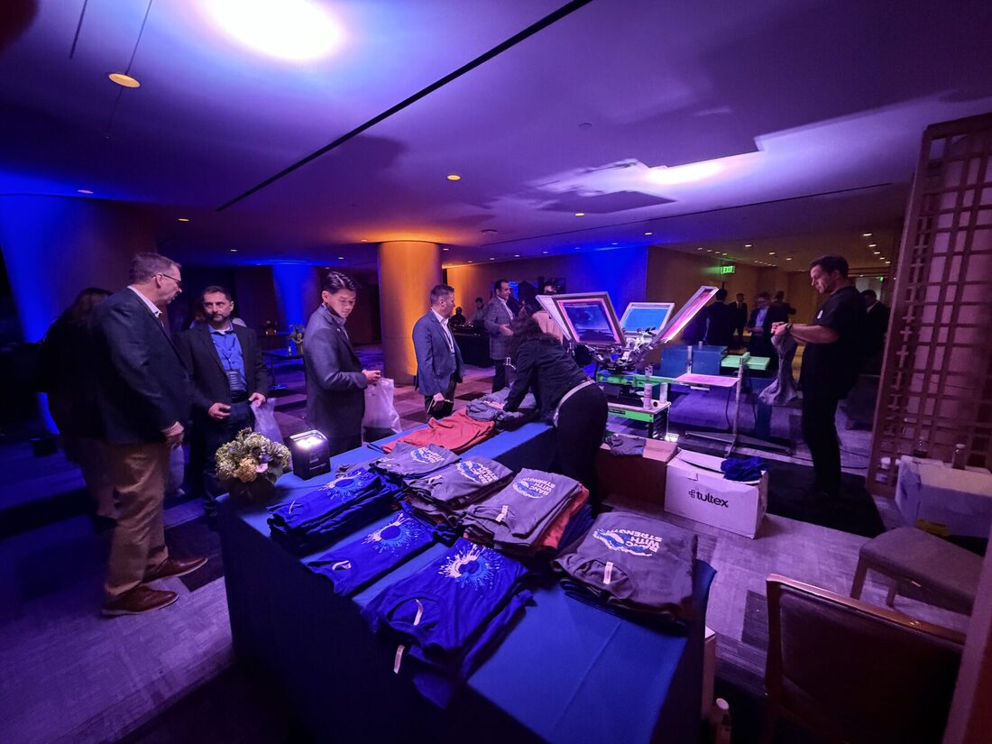 Merch styled in a lounge setting beside seating