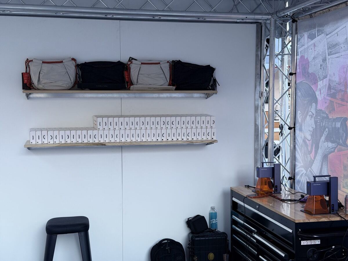 Shelf of custom merch organized by size and style